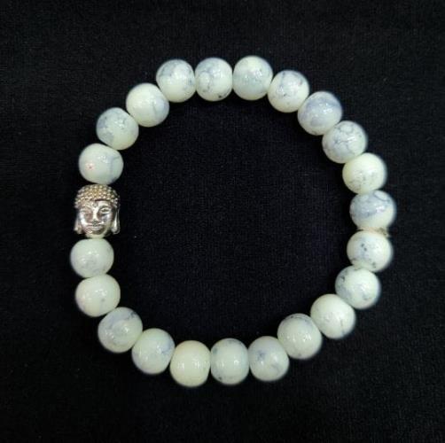 White marble stone bracelet with a Buddha charm is an exquisite and meaningful piece of jewelry