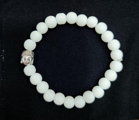 Pure White Pearl bracelet with a Buddha charm is an exquisite and meaningful piece of jewelry