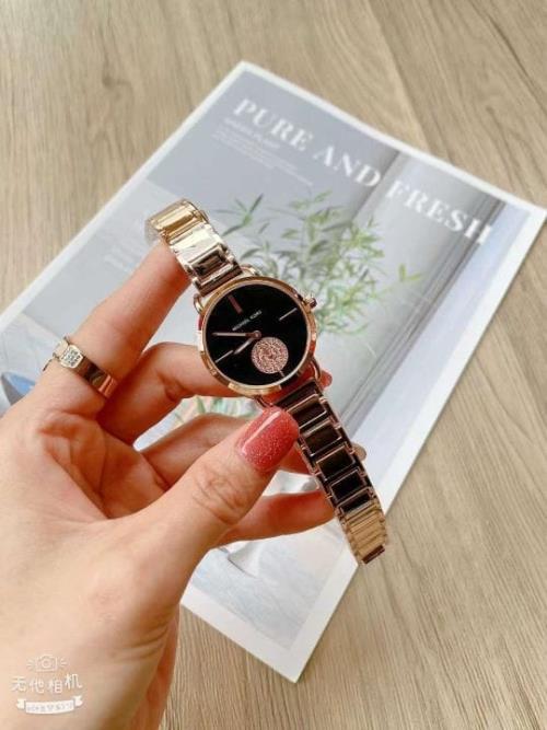 Michael Kors Ladies Watch: Timeless Chronograph Functionality with Signature Style.
