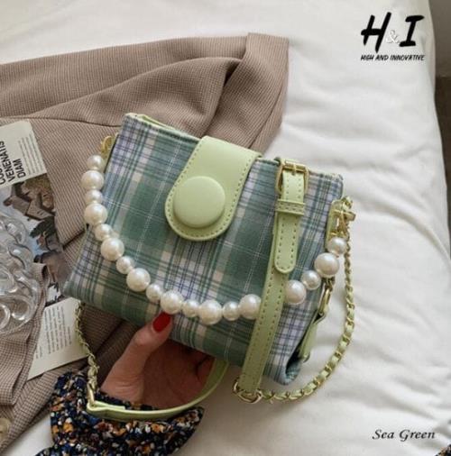  HIGH QUALITY IMPORTED NEW STYLE PEARL KEYCHAIN SLING/CROSSBODY BAGS    .